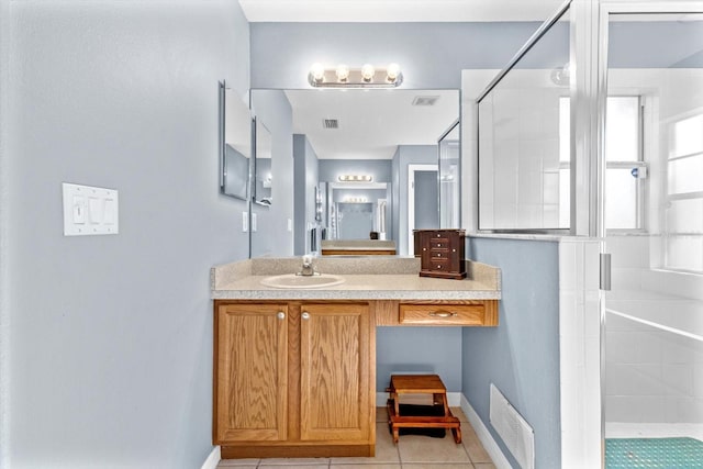 full bath featuring a shower stall, visible vents, tile patterned flooring, and vanity