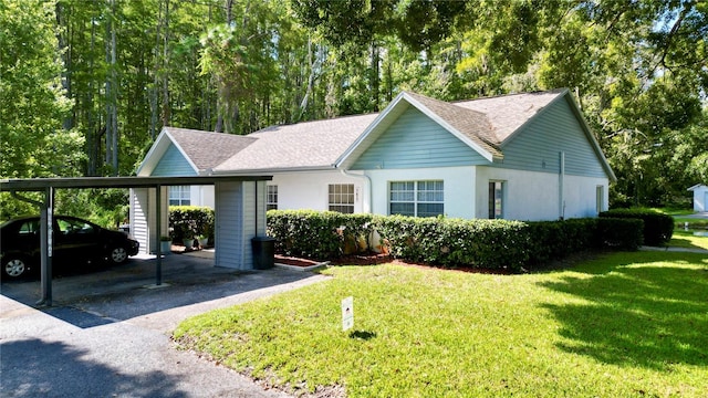 ranch-style home with a front lawn