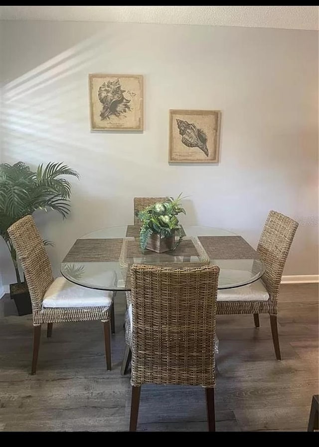 dining room with hardwood / wood-style floors