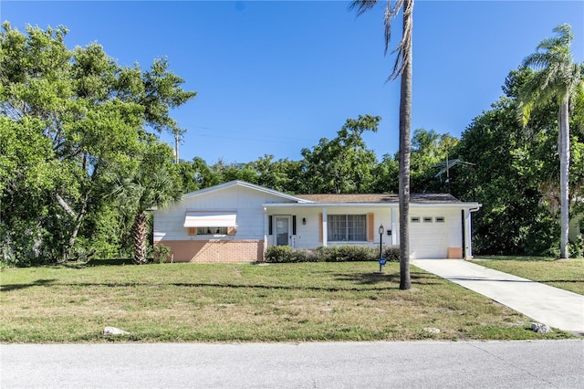 single story home featuring a garage and a front lawn