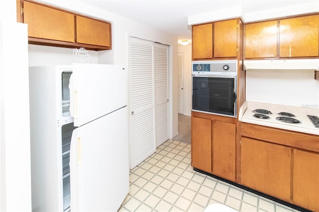 kitchen featuring white appliances