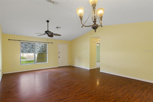 empty room with ceiling fan with notable chandelier, vaulted ceiling, and dark wood-type flooring