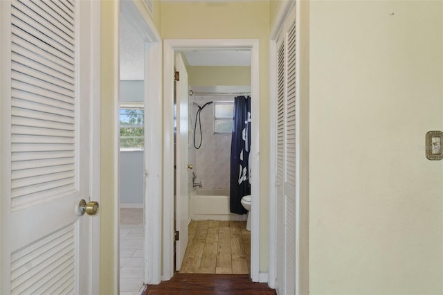 hallway with dark hardwood / wood-style floors