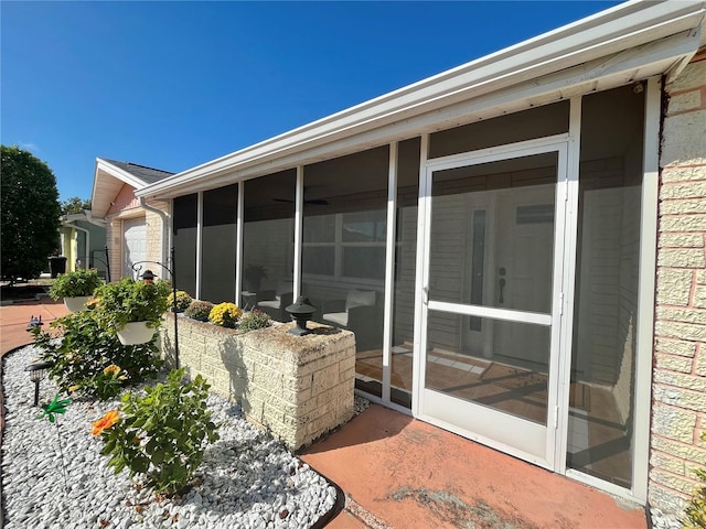 view of patio / terrace featuring a sunroom