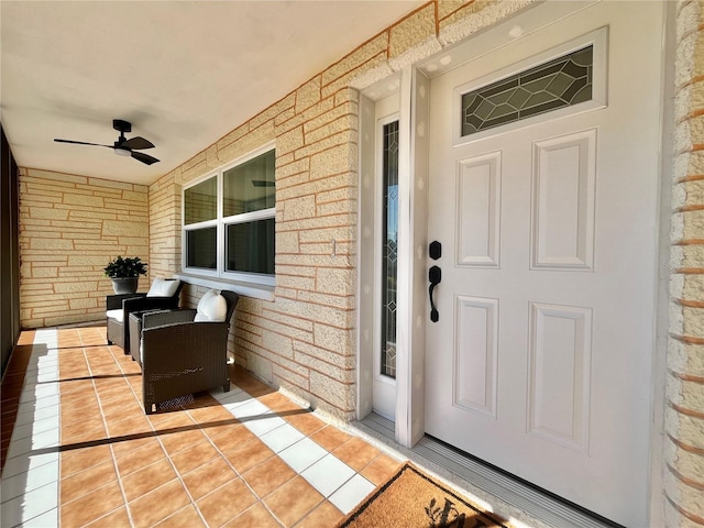 doorway to property with ceiling fan