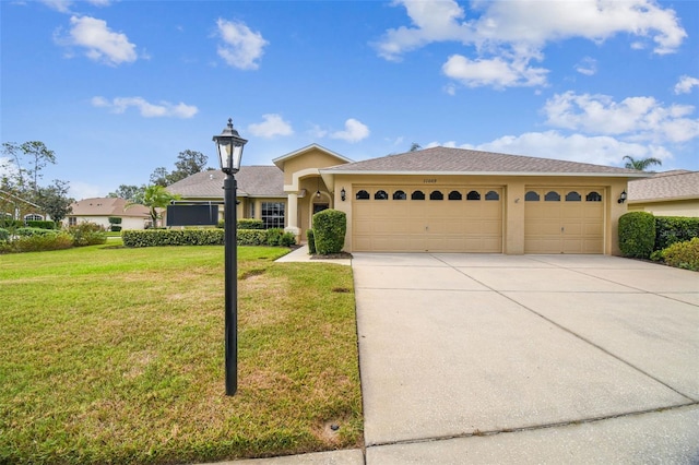 view of front of property featuring a front lawn and a garage