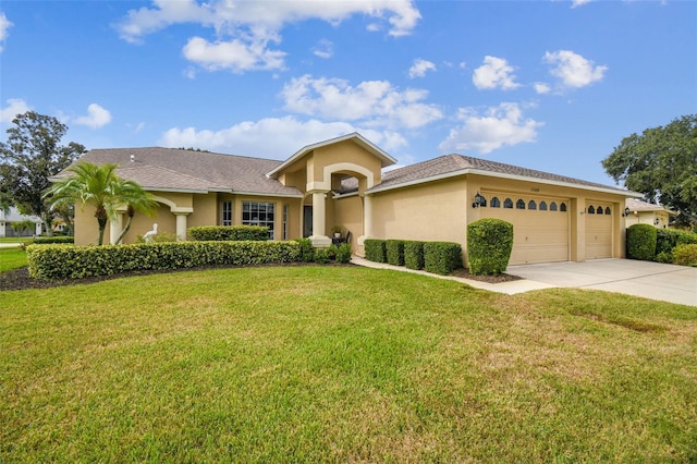 view of front facade with a front lawn and a garage