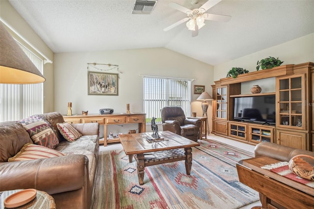 living room with lofted ceiling and ceiling fan