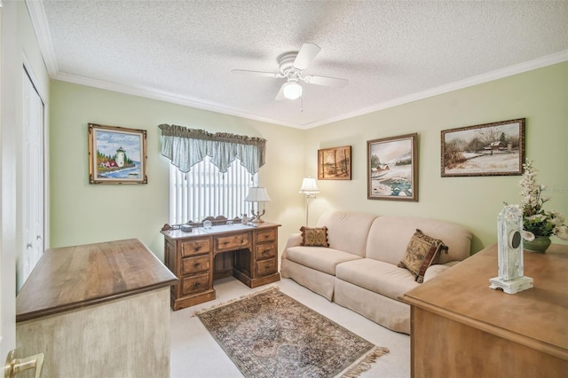 living room with a textured ceiling, light carpet, ceiling fan, and crown molding