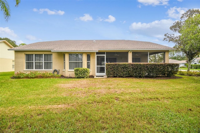 ranch-style home with a front lawn and a sunroom