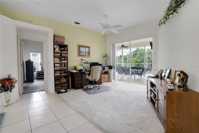 tiled office featuring ceiling fan