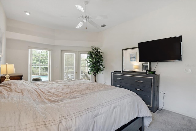 carpeted bedroom featuring access to outside, ceiling fan, and french doors