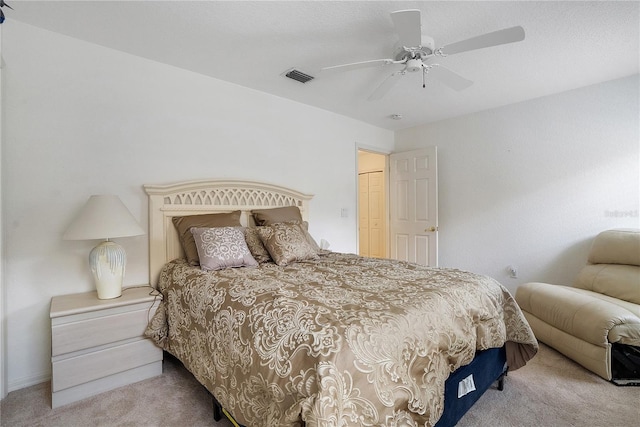 bedroom featuring ceiling fan and light colored carpet