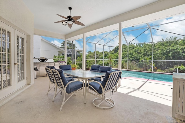 exterior space with ceiling fan and a pool