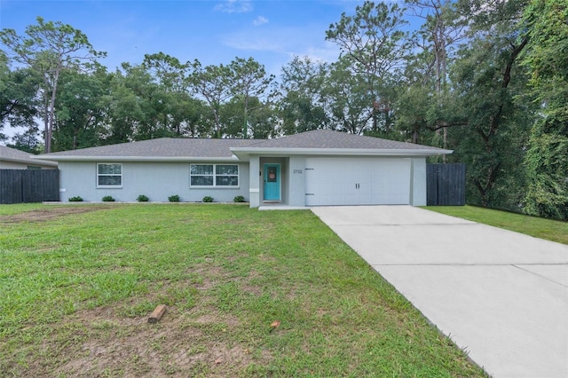 ranch-style home featuring a garage and a front lawn