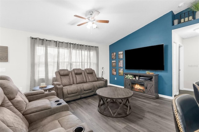 living room featuring lofted ceiling, ceiling fan, and hardwood / wood-style flooring