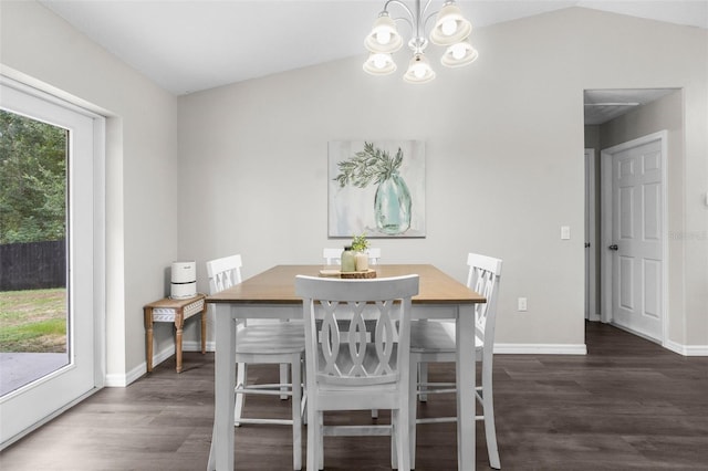 dining space with an inviting chandelier, vaulted ceiling, and dark hardwood / wood-style flooring