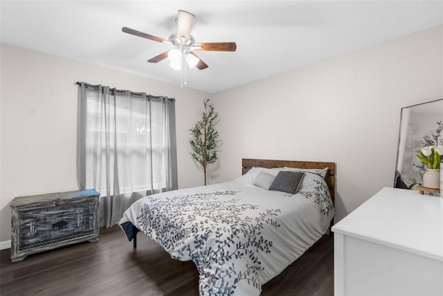 bedroom with ceiling fan and dark hardwood / wood-style flooring