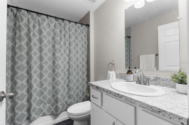 full bathroom with a textured ceiling, vanity, toilet, and shower / bath combination with curtain