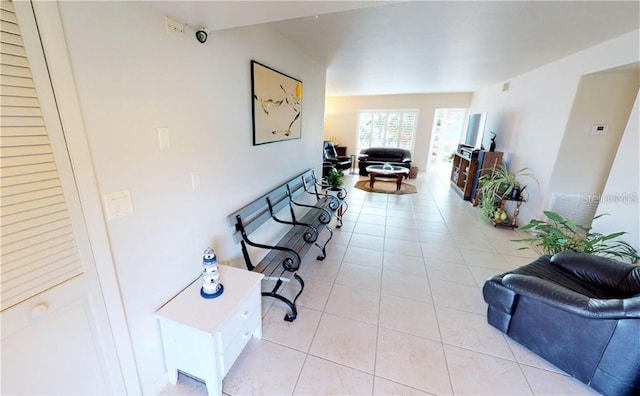 hallway with light tile patterned flooring