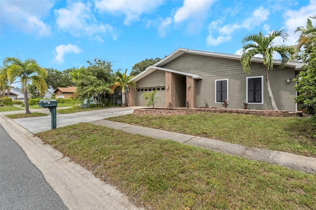 view of front of home featuring a garage and a front lawn