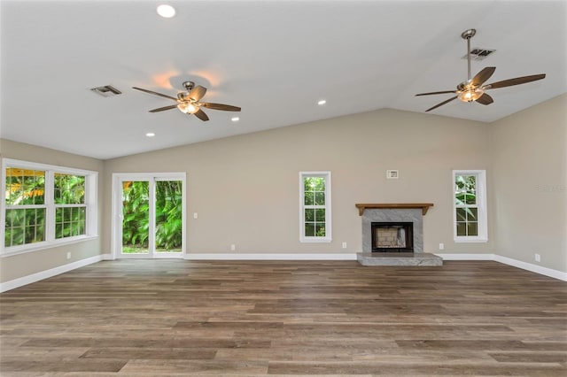 unfurnished living room with lofted ceiling, ceiling fan, and dark hardwood / wood-style flooring