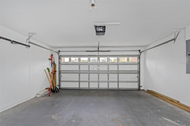 garage with electric panel and a garage door opener