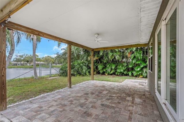 view of patio / terrace with a water view and ceiling fan