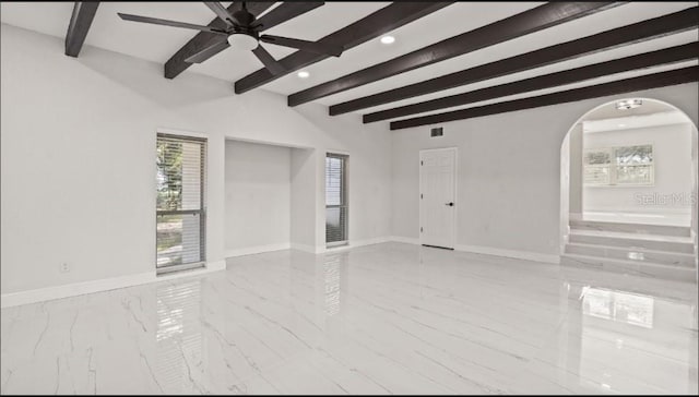 interior space with beam ceiling and ceiling fan