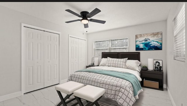 bedroom with two closets and ceiling fan