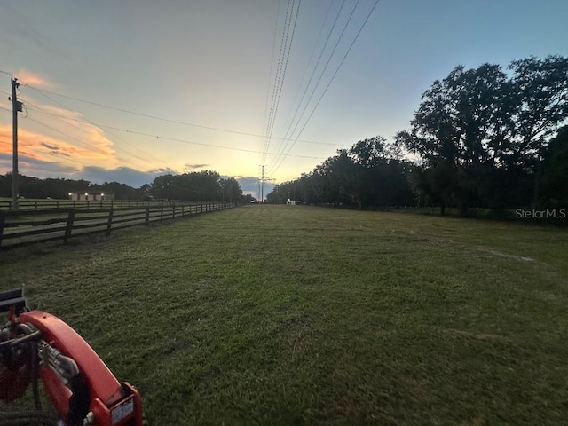 view of yard at dusk