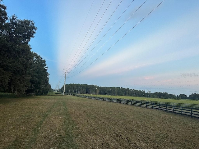 view of yard with a rural view