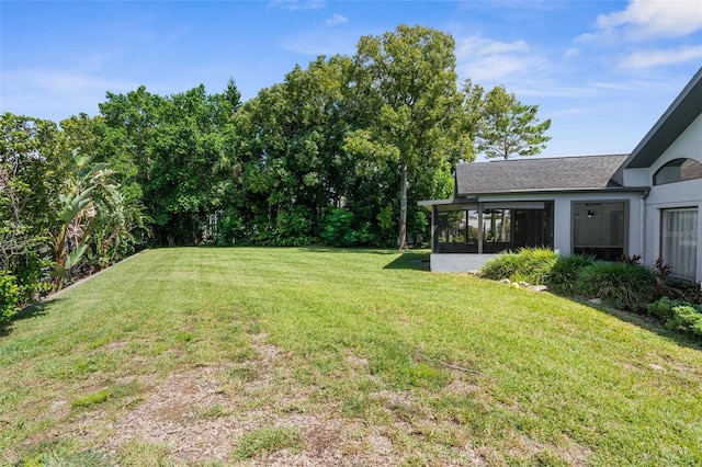 view of yard featuring a sunroom