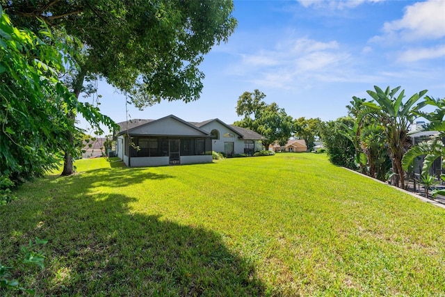 view of yard featuring a sunroom