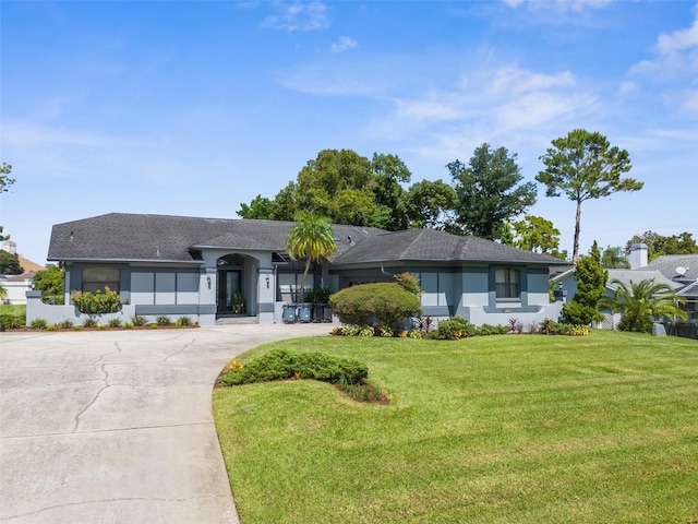 ranch-style house featuring a front lawn