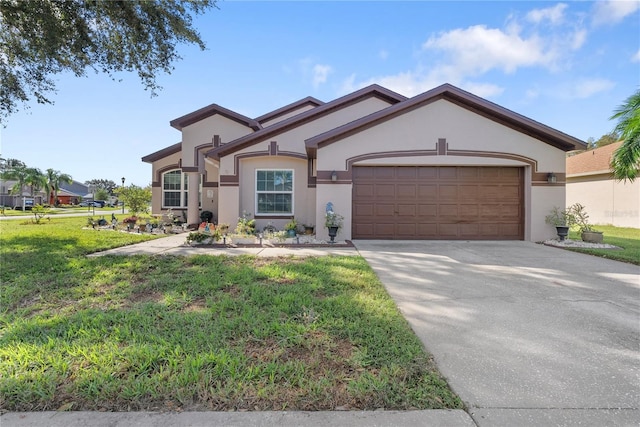 view of front of home featuring a front lawn and a garage