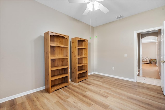 unfurnished room featuring light hardwood / wood-style flooring and ceiling fan