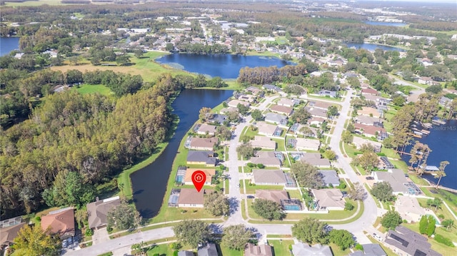 birds eye view of property featuring a residential view and a water view