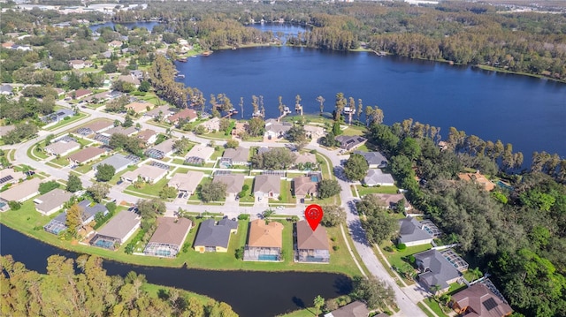 birds eye view of property featuring a residential view and a water view