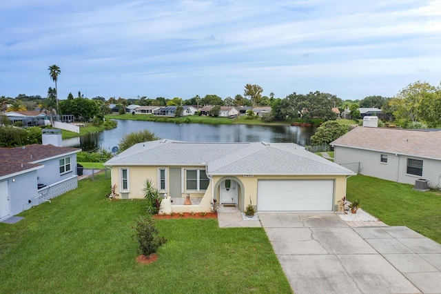 ranch-style home with central AC, a water view, a front lawn, and a garage