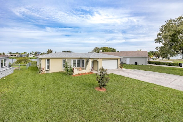 ranch-style home featuring a front lawn and a garage