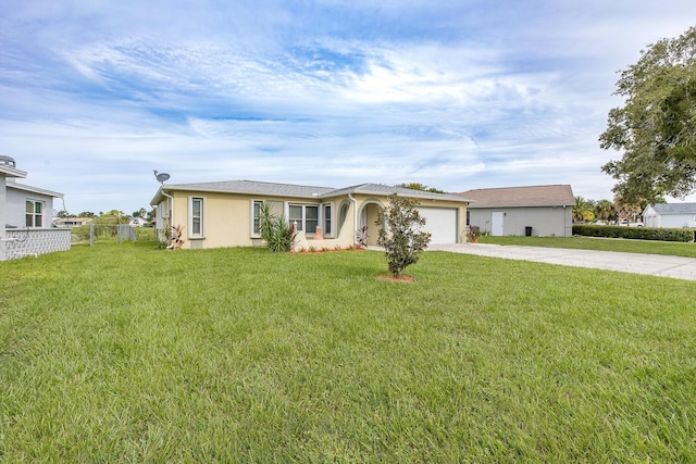 ranch-style house featuring a garage and a front yard