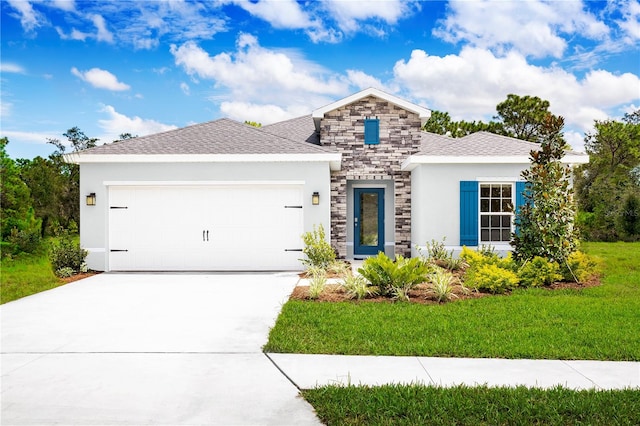 view of front of house with a garage and a front yard