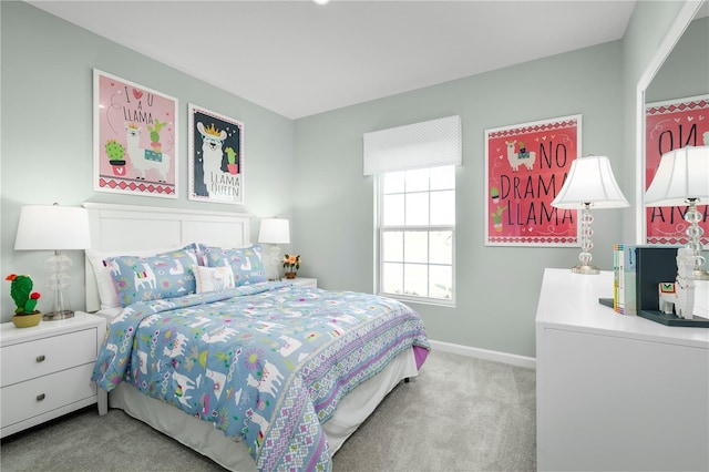 bedroom featuring light colored carpet