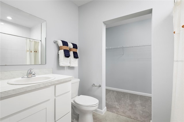 bathroom with tile patterned flooring, a shower with curtain, vanity, and toilet