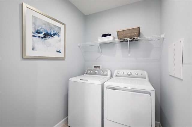 clothes washing area featuring washing machine and dryer