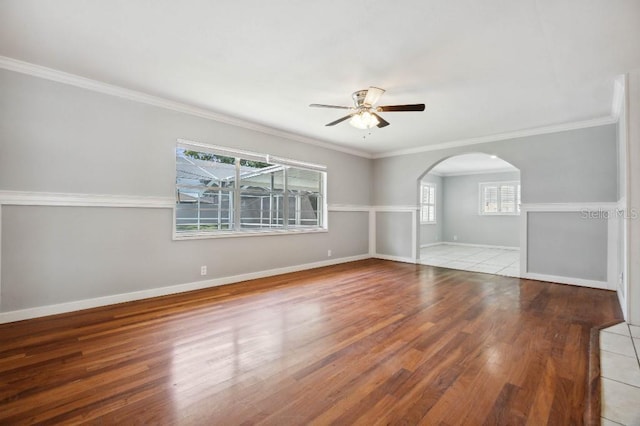 unfurnished room with ceiling fan, light hardwood / wood-style flooring, and ornamental molding