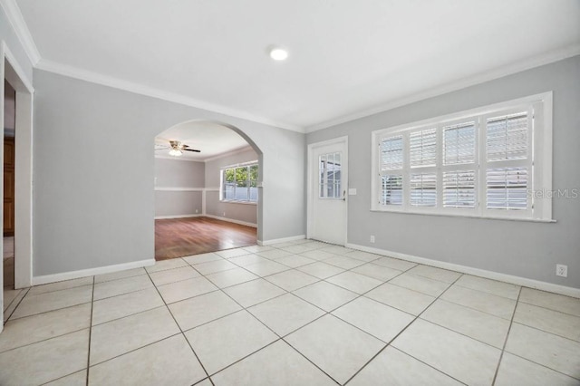 spare room featuring ceiling fan, ornamental molding, and light hardwood / wood-style flooring