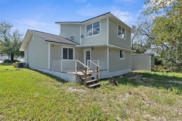 10221 Elgin Blvd, Spring Hill, FL 34608 - rear view of house with a lawn and a porch