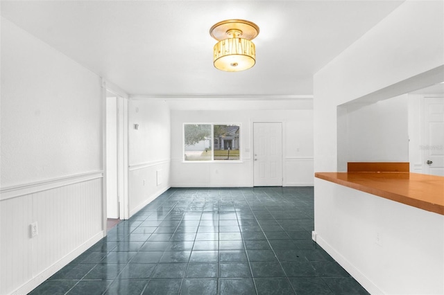 10221 Elgin Blvd, Spring Hill, FL 34608 - spare room featuring dark tile patterned flooring